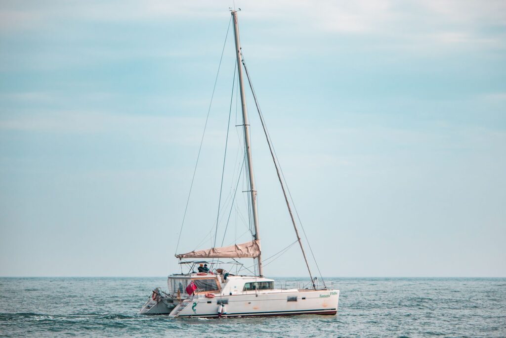 Sailing catamaran under sail on a calm Mediterranean sea